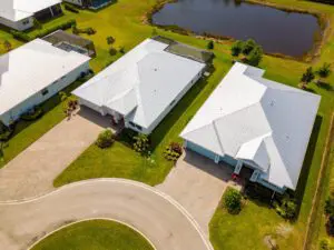 metal roof colors-arial view of white metal roofing on houses