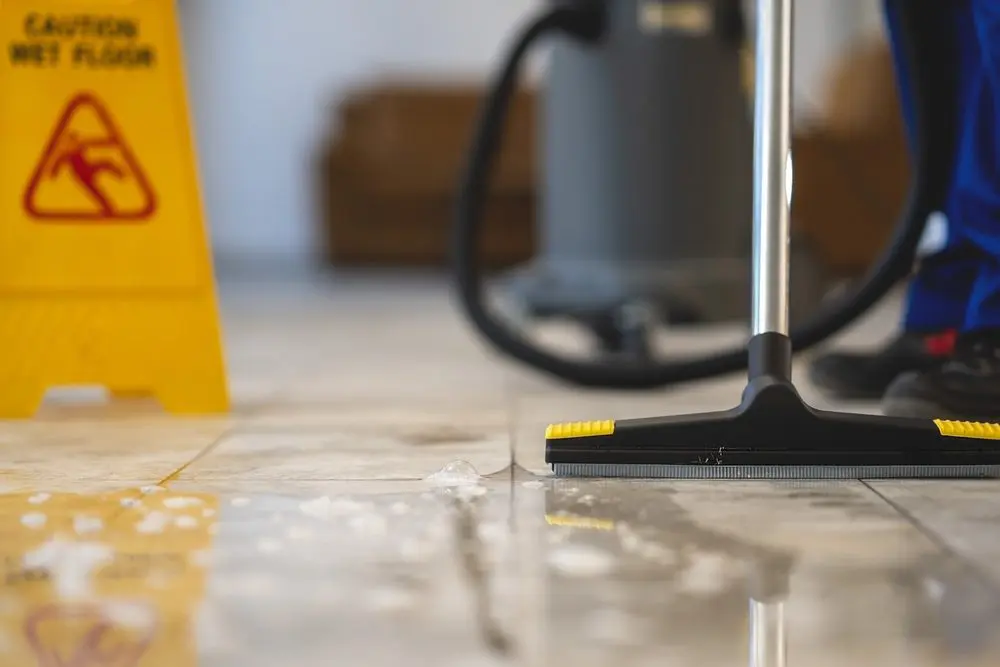 Professional Water Removal from the Floor with a Vacuum Cleaner