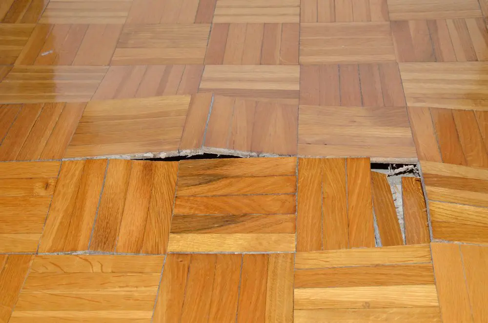 Wooden Floor in Apartment with Floor Damage
