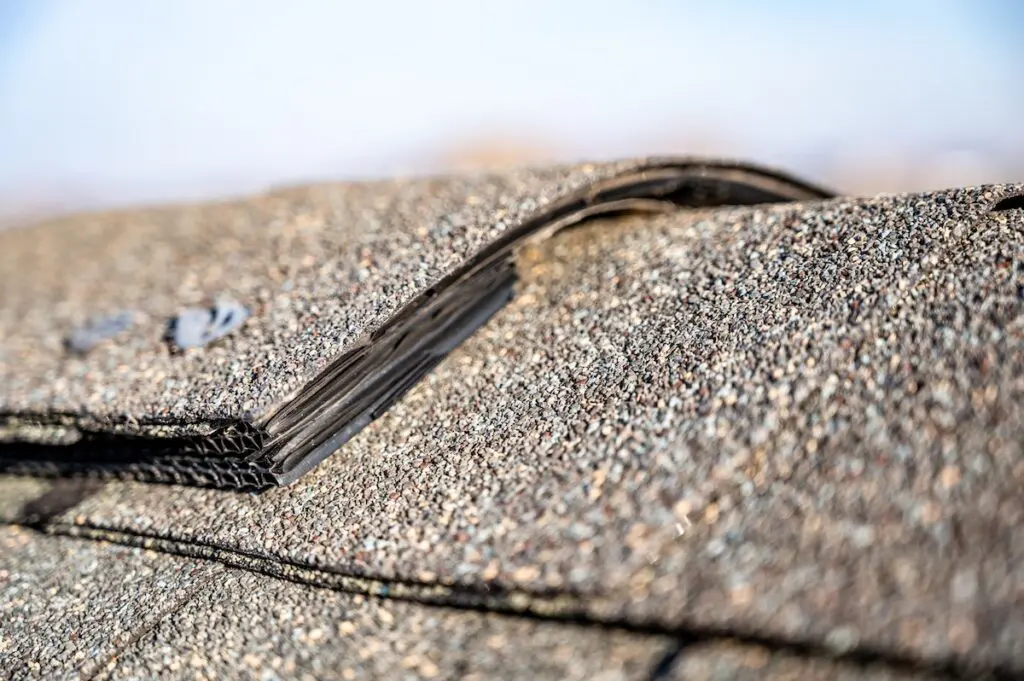 Typical residential ridge cap on a shingle roof apex