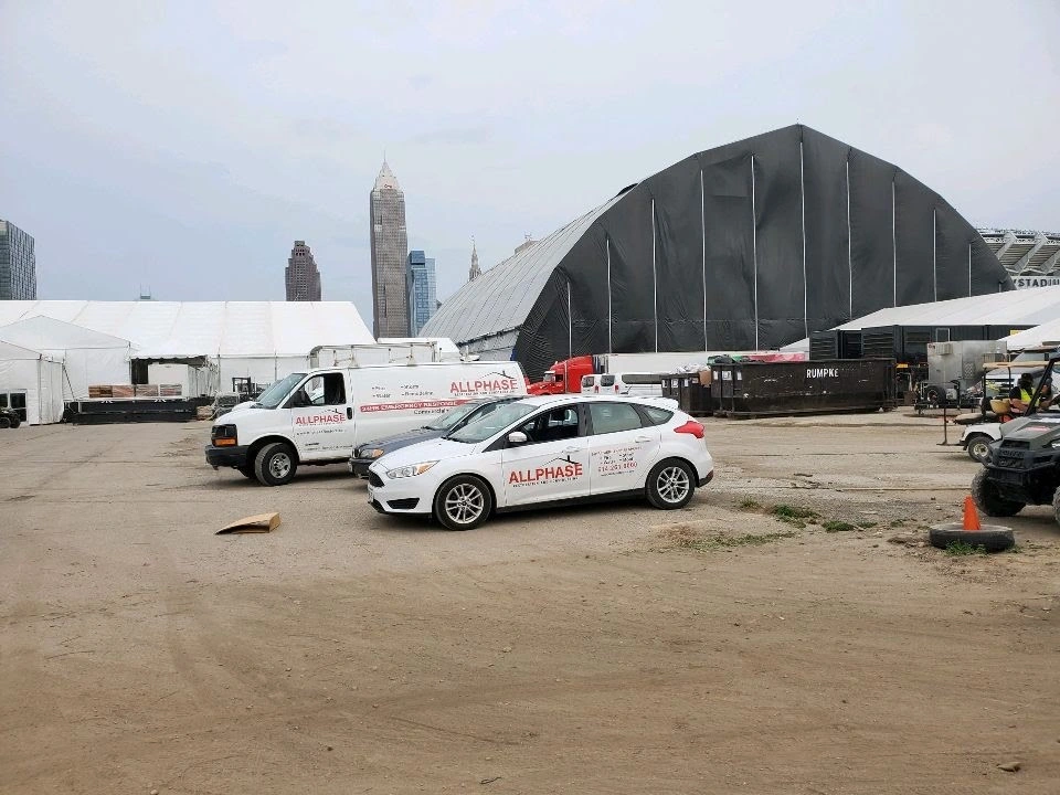 allphase restoration vehicles in front of an industrial warehouse