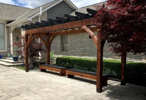 custom wooden portico outside a home