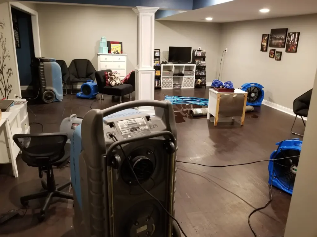 Dehumidifiers in a basement that has experienced a burst pipe
