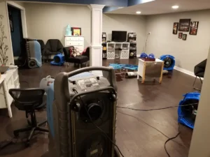 Dehumidifiers in a basement that has experienced a burst pipe