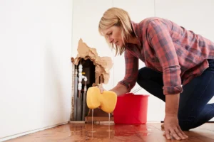 woman cleaning the floor caused from water damage