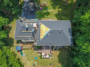 construction crew replacing the house roof
