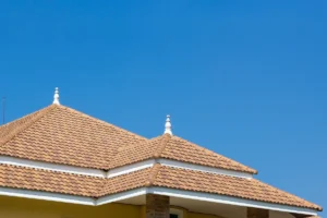 tile roof of luxury house against blue sky