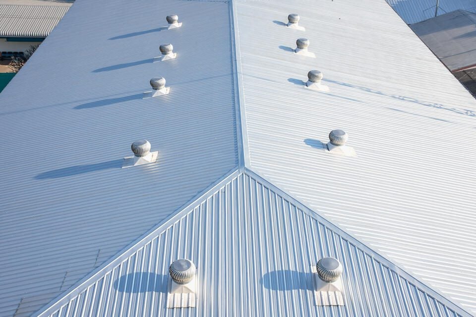 Corrugated Metal Roof: Installation, Repair and Maintenance - All Phase Roofing & Restoration corrugated metal roof-arial view of white corrugated commercial roof