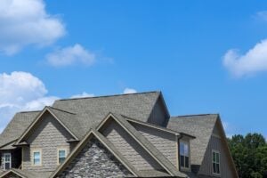 Top-Notch Mold Remediation in Dublin, OH - All Phase Roofing & Restoration Work on a new roof covering asphalt shingles in the roofing construction of a house