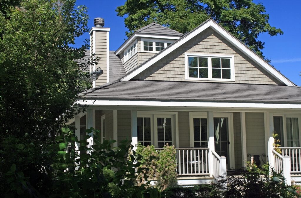 GAF Vs. Owens Corning Shingles: Pros & Cons - All Phase Roofing & Restoration Cottage with Grey Shingles GAF vs owens corning