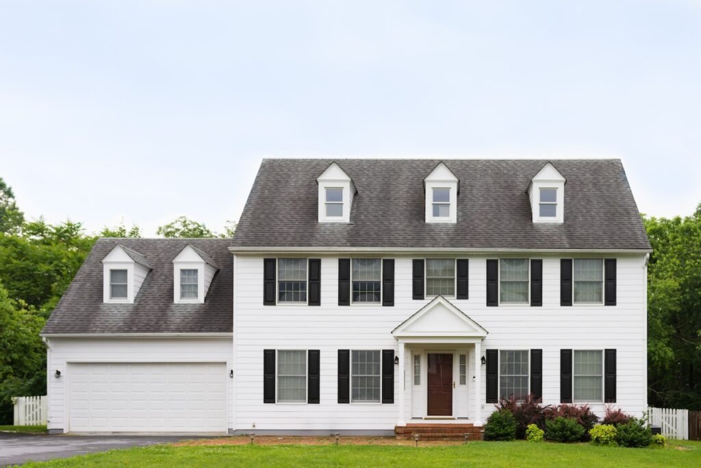 How to Add Curb Appeal to a Flat Front House? 8 Ideas - AllPhase Restoration Clean and quaint colonial house, front street view